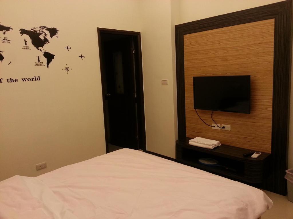Postel nebo postele na pokoji v ubytování Fishmoon homestay