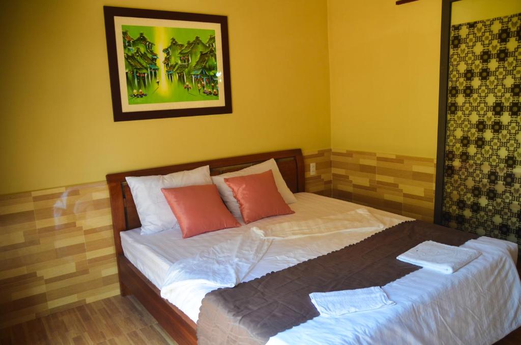 Postel nebo postele na pokoji v ubytování Coco Bungalows Hoi An