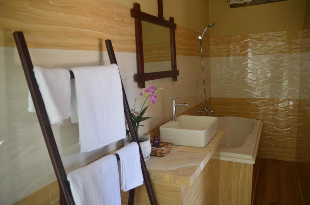Koupelna v ubytování Coco Bungalows Hoi An