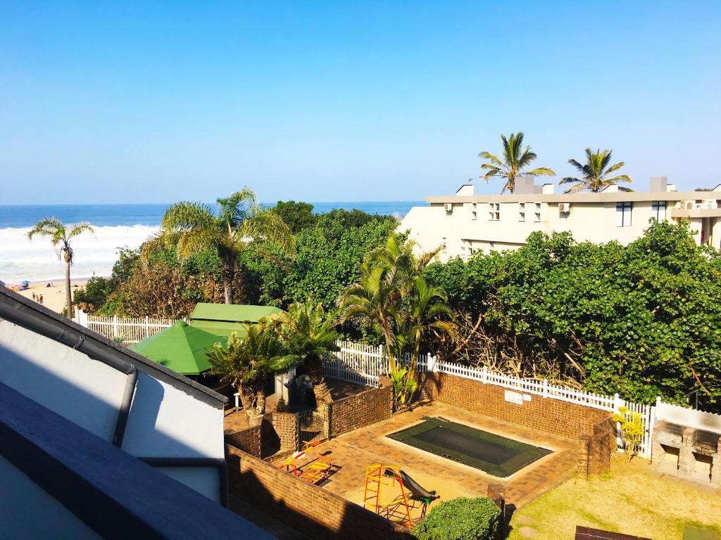 a view of the beach from the balcony of a house at Dumela Margate Flat No 18 in Margate