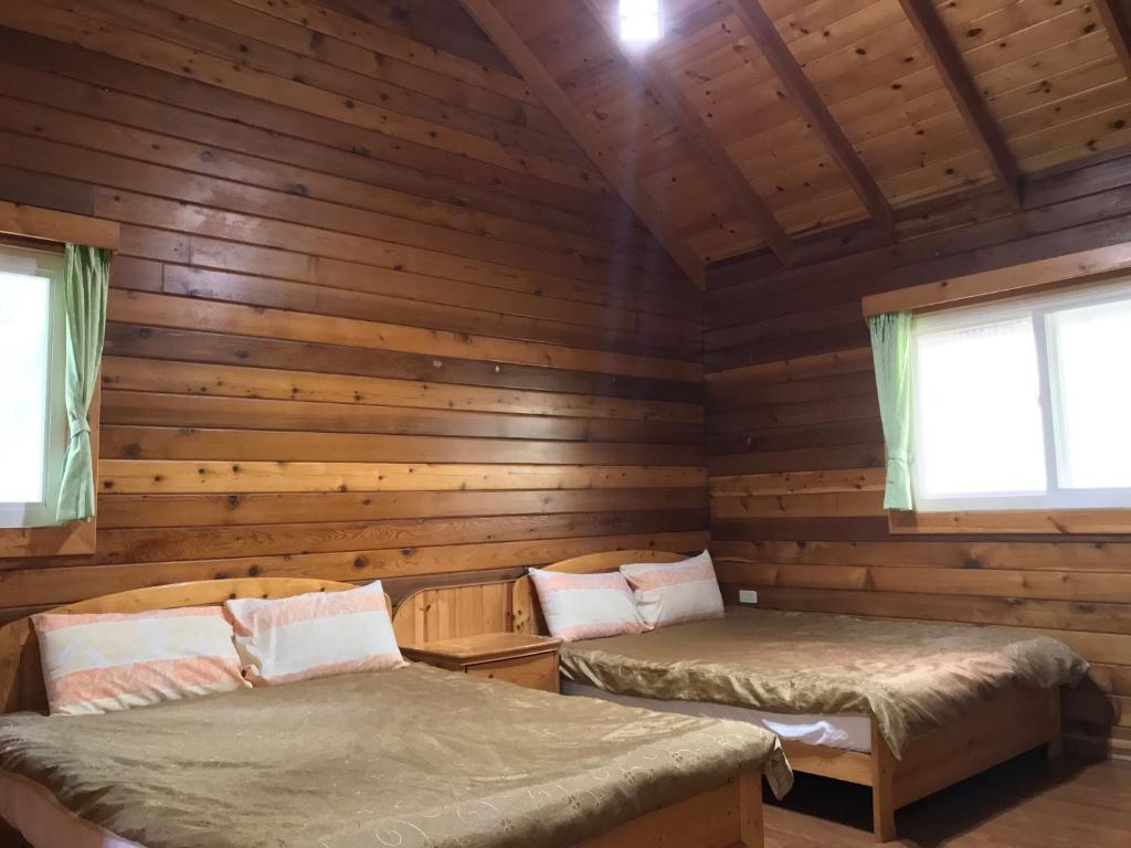 Postel nebo postele na pokoji v ubytování Jin Zu Cottage