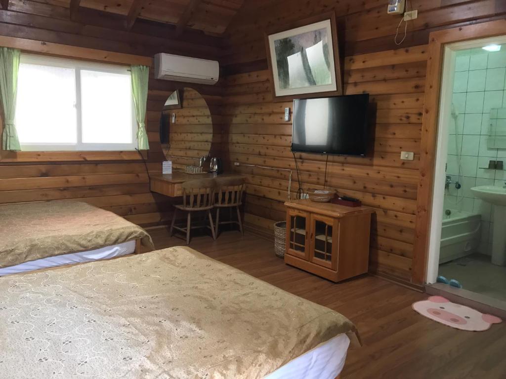 Postel nebo postele na pokoji v ubytování Jin Zu Cottage