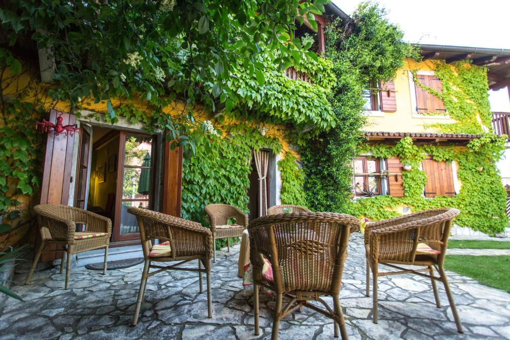 a group of chairs sitting in front of a building at Rozina Vacation House in Pliskovica