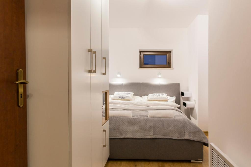 Posteľ alebo postele v izbe v ubytovaní Banialuka Apart