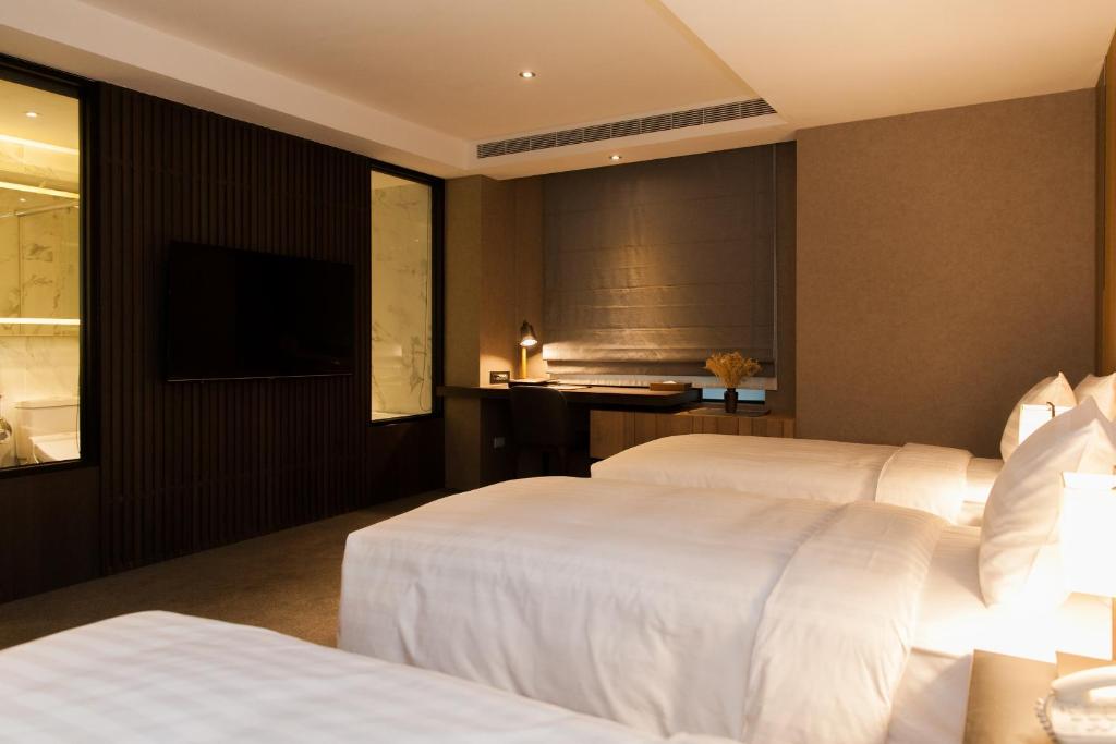 Postel nebo postele na pokoji v ubytování Hotel East Taipei