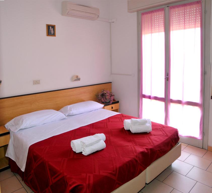 Postel nebo postele na pokoji v ubytování Hotel Levante