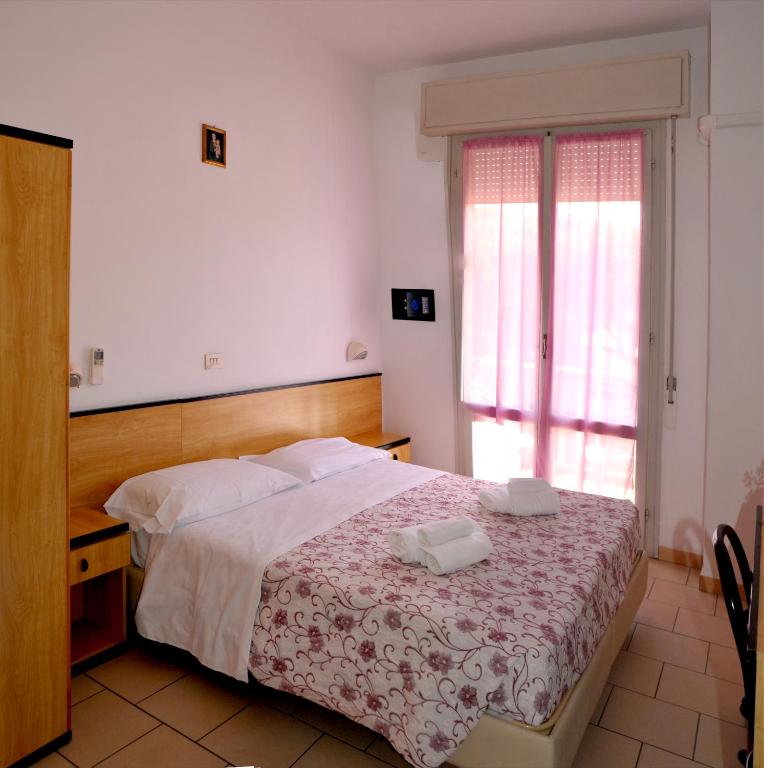 Postel nebo postele na pokoji v ubytování Hotel Levante