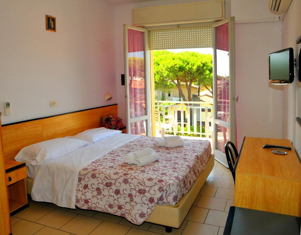 Postel nebo postele na pokoji v ubytování Hotel Levante