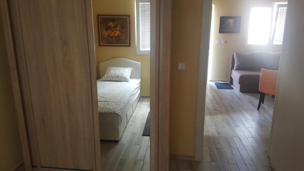 Postel nebo postele na pokoji v ubytování Apartments Kli Kli