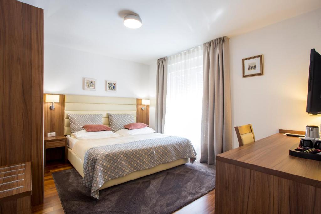 Postel nebo postele na pokoji v ubytování Residence Villa Karda