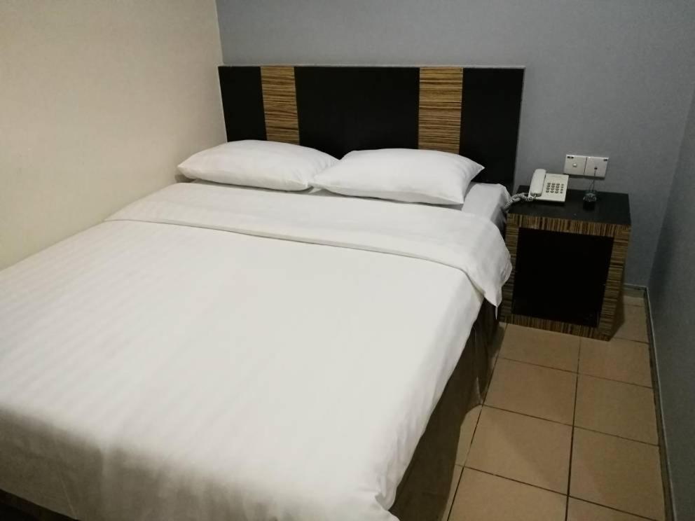 Postel nebo postele na pokoji v ubytování Hotel Traveller