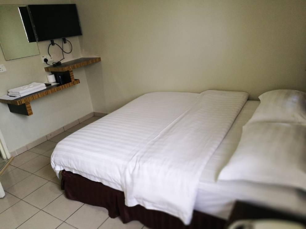 Postel nebo postele na pokoji v ubytování Hotel Traveller