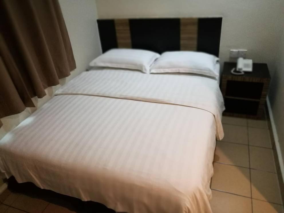 Postel nebo postele na pokoji v ubytování Hotel Traveller