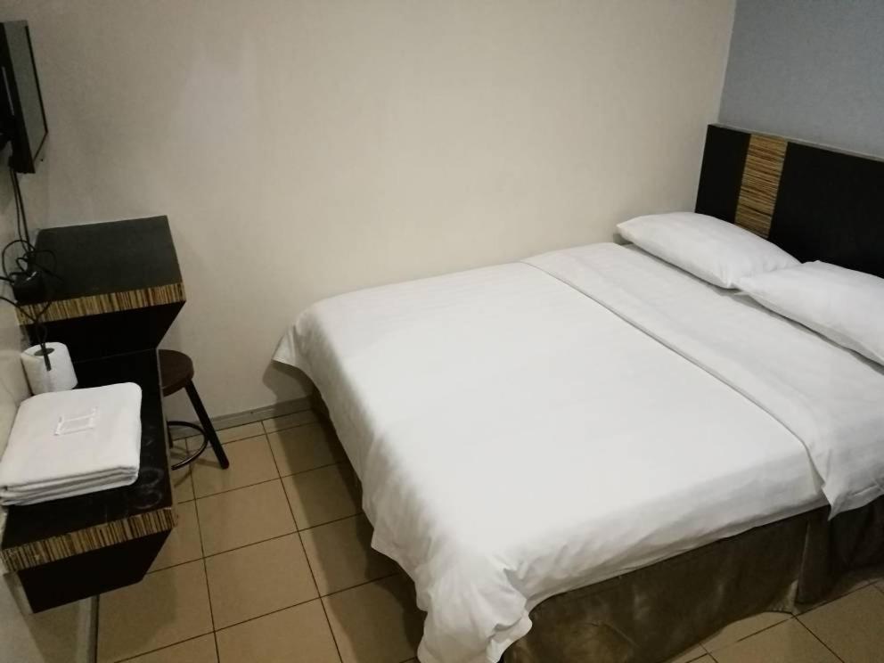 Postel nebo postele na pokoji v ubytování Hotel Traveller