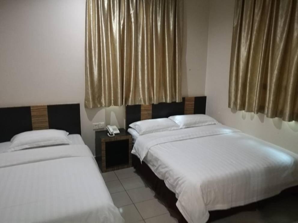 Postel nebo postele na pokoji v ubytování Hotel Traveller