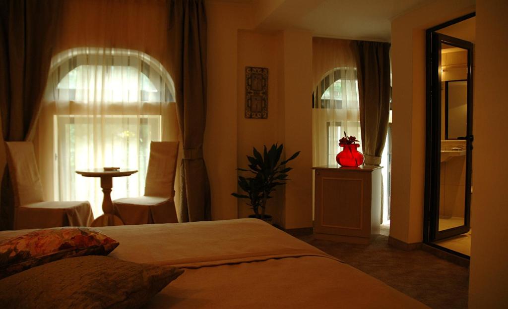 Postel nebo postele na pokoji v ubytování Hi Boutique Hotel