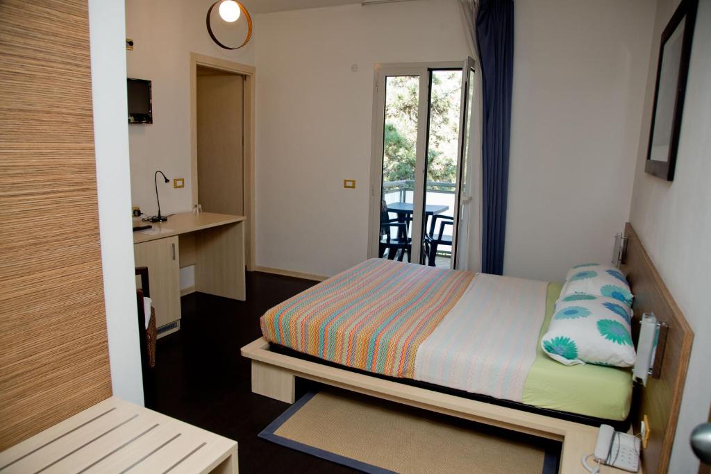 A bed or beds in a room at Hotel Anapaya
