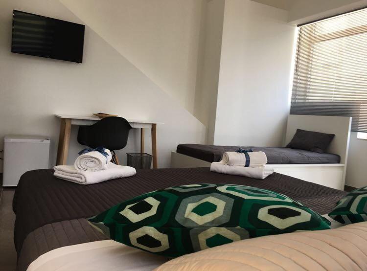 Postel nebo postele na pokoji v ubytování Corte Sveva B&B Affittacamere