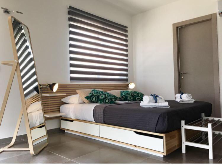 Postel nebo postele na pokoji v ubytování Corte Sveva B&B Affittacamere