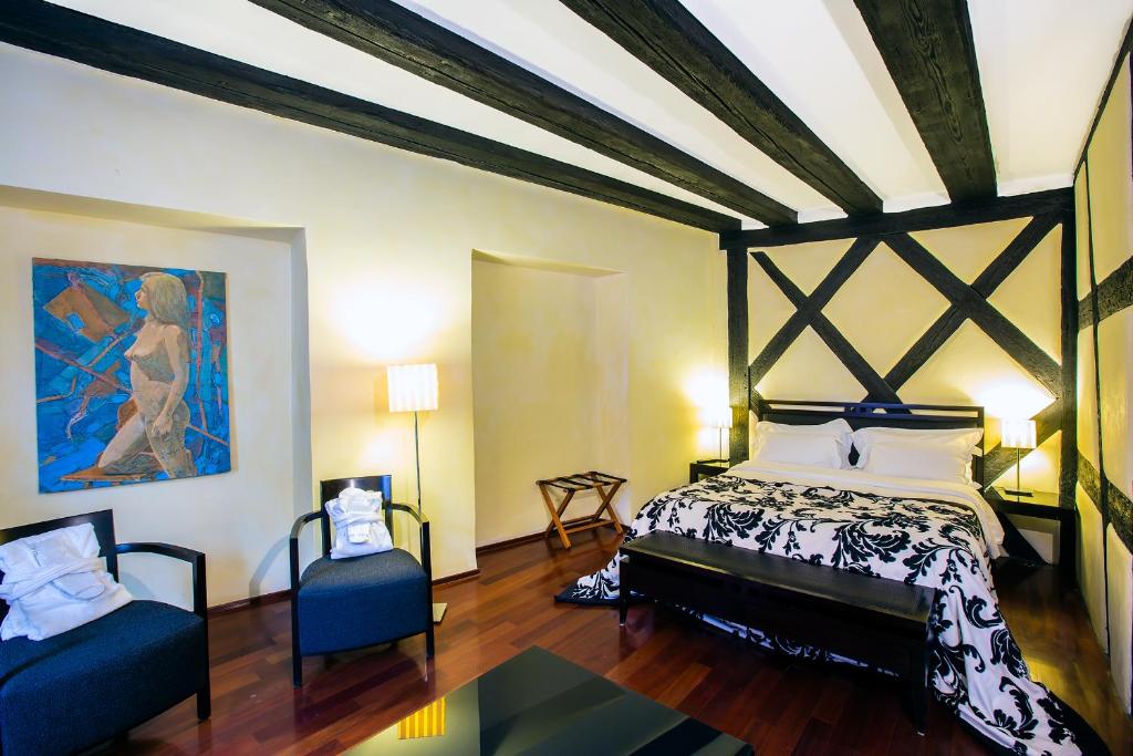 Postel nebo postele na pokoji v ubytování Le B. Suites, Chambres & Restaurant