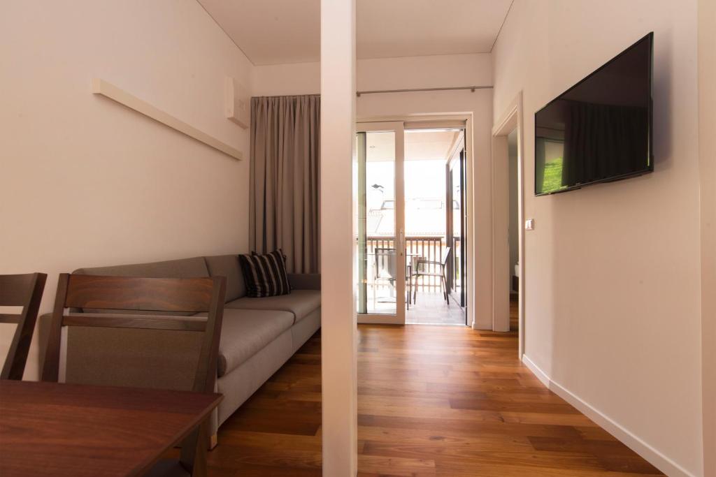 TV a/nebo společenská místnost v ubytování Apparthotel Calma