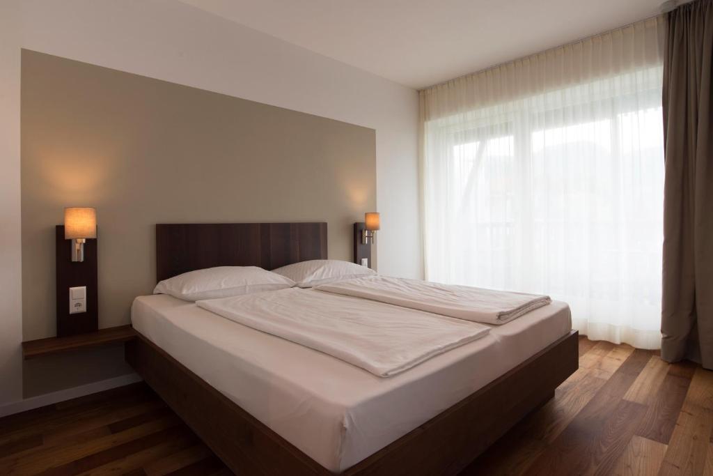 Postel nebo postele na pokoji v ubytování Apparthotel Calma