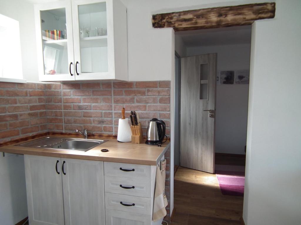 Kuchyň nebo kuchyňský kout v ubytování Apartment 1