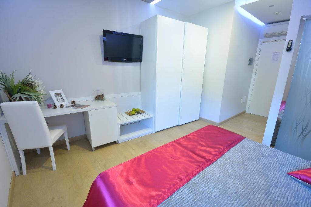 TV a/nebo společenská místnost v ubytování Albergo Ardesio Da Giorgio