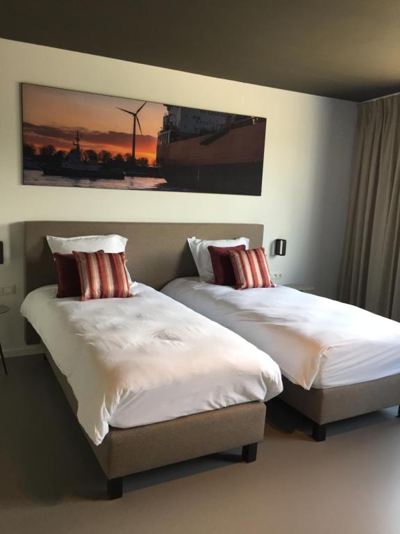 Postel nebo postele na pokoji v ubytování TRUST Hotel