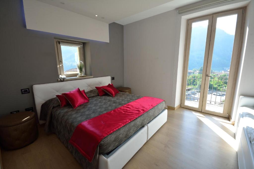 Postel nebo postele na pokoji v ubytování Albergo Ardesio Da Giorgio