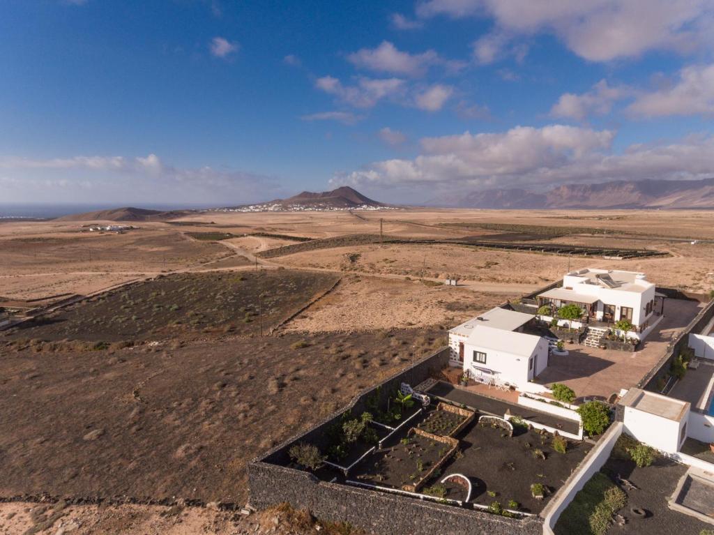 an aerial view of a white building in the desert at Villa El Jable Lanzarote in Teguise