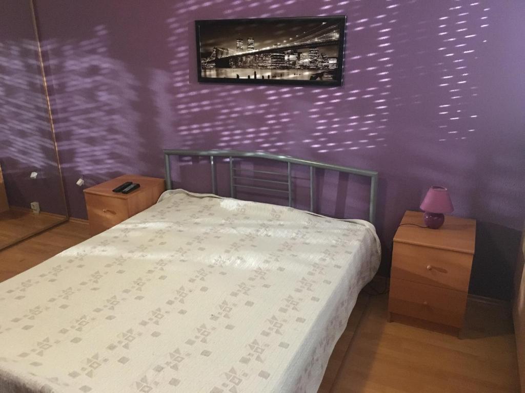 Posteľ alebo postele v izbe v ubytovaní Málnás Macska Apartman