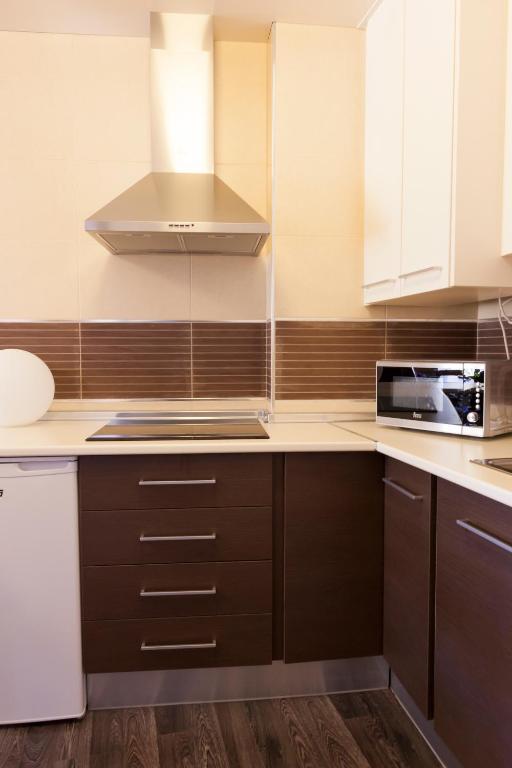 A kitchen or kitchenette at Apartamentos Sol de Mayo