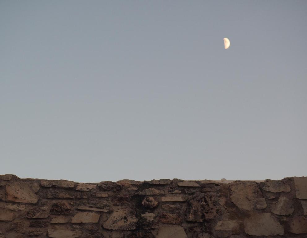 a brick wall with a white sky in the background at Trinity Boutique Hotel in Rhodes Town