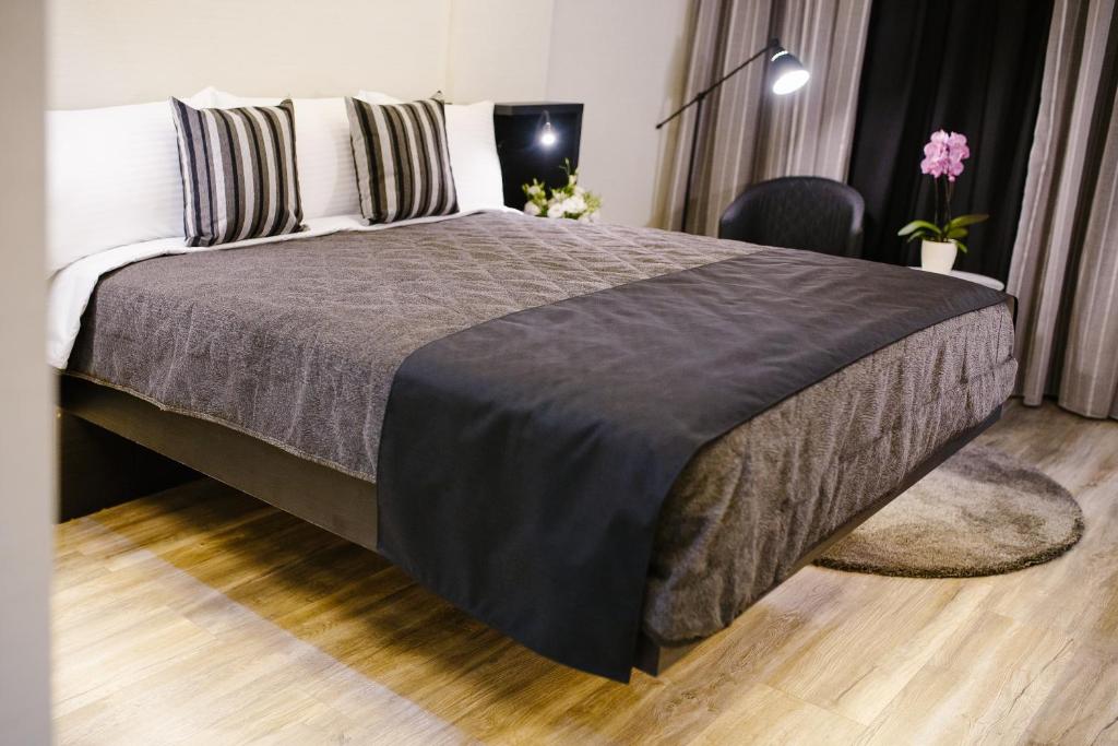 Postel nebo postele na pokoji v ubytování Qbic City Hotel