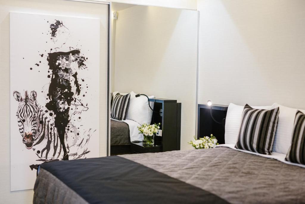 Postel nebo postele na pokoji v ubytování Qbic City Hotel
