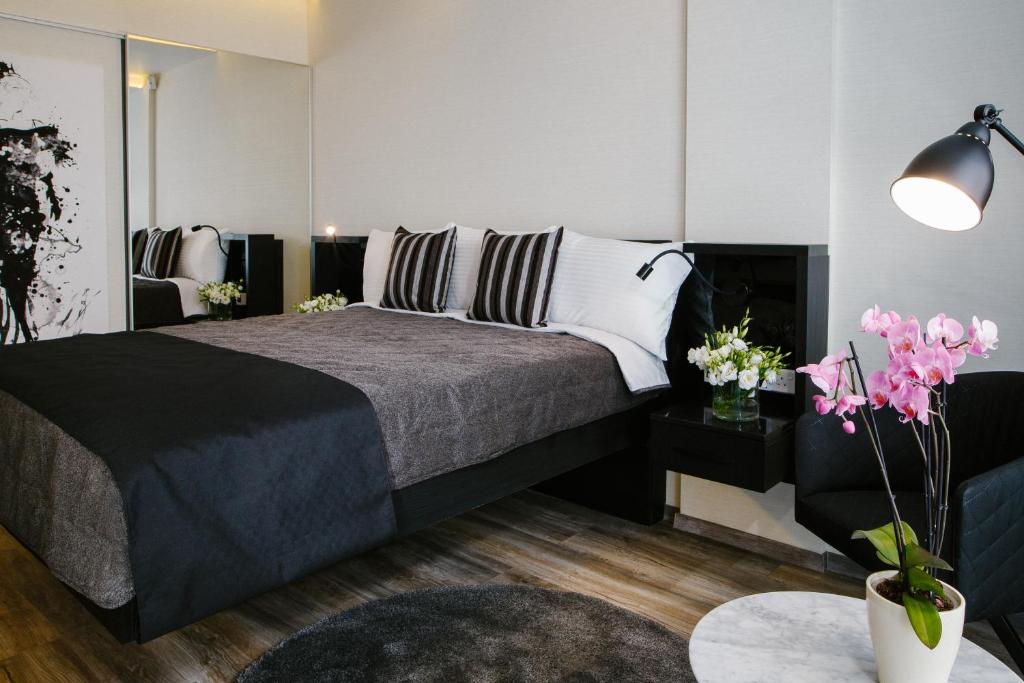 Postel nebo postele na pokoji v ubytování Qbic City Hotel