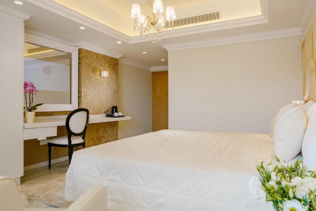 Postel nebo postele na pokoji v ubytování Qbic City Hotel