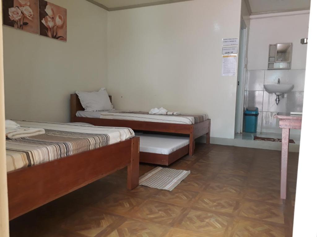 Postel nebo postele na pokoji v ubytování Krizma Inn