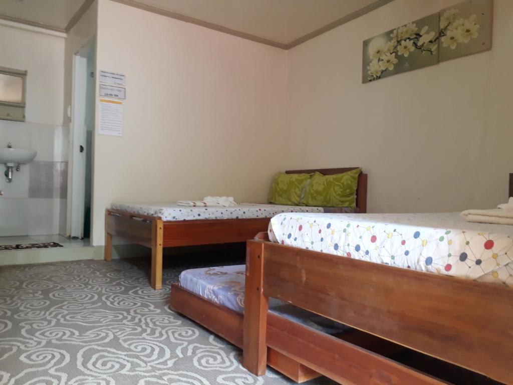 Postel nebo postele na pokoji v ubytování Krizma Inn