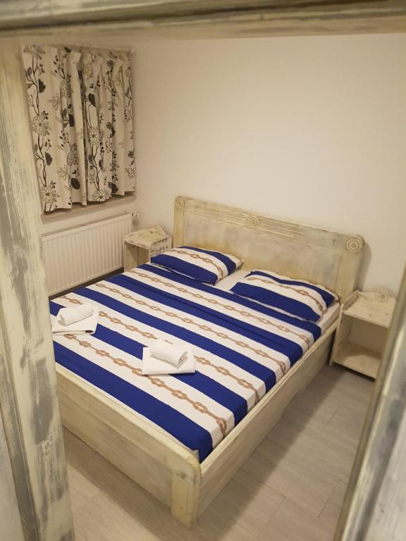 Posteľ alebo postele v izbe v ubytovaní Zorić Apartments & Rooms