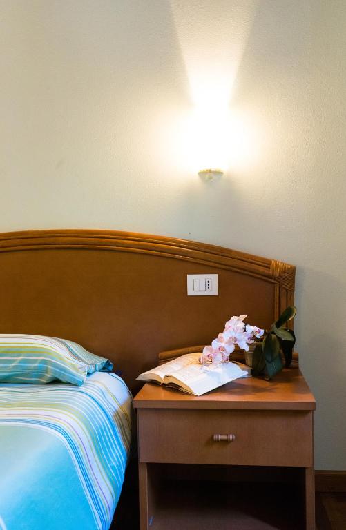 Postel nebo postele na pokoji v ubytování Agriturismo Fogolar da Capo