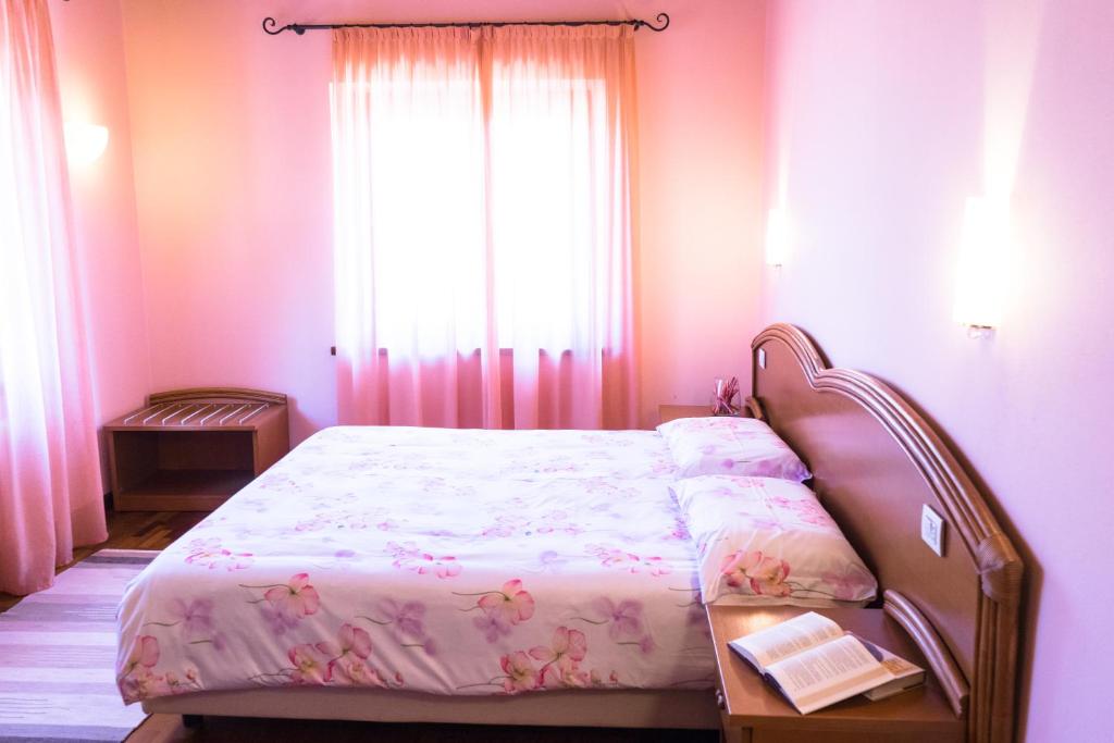 Postel nebo postele na pokoji v ubytování Agriturismo Fogolar da Capo