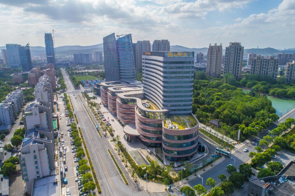 an aerial view of a city with tall buildings at Jingling Shihu Garden Hotel  in Suzhou