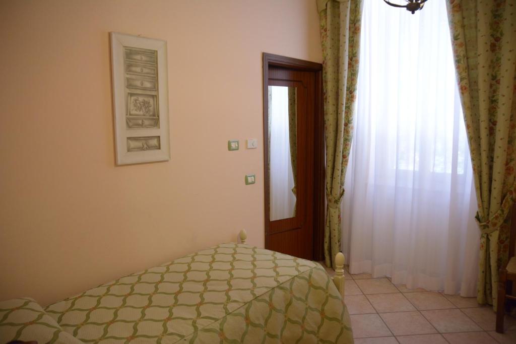 Postel nebo postele na pokoji v ubytování Ai 3 Archi