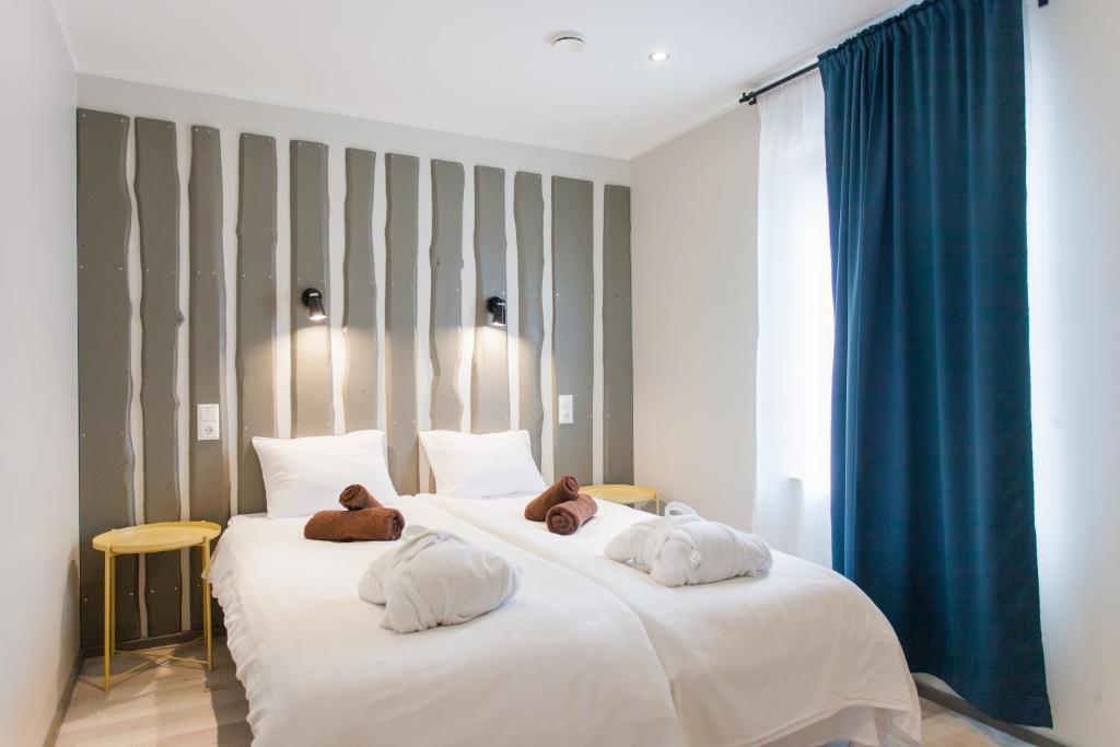 Postel nebo postele na pokoji v ubytování Johan Suites & Spa