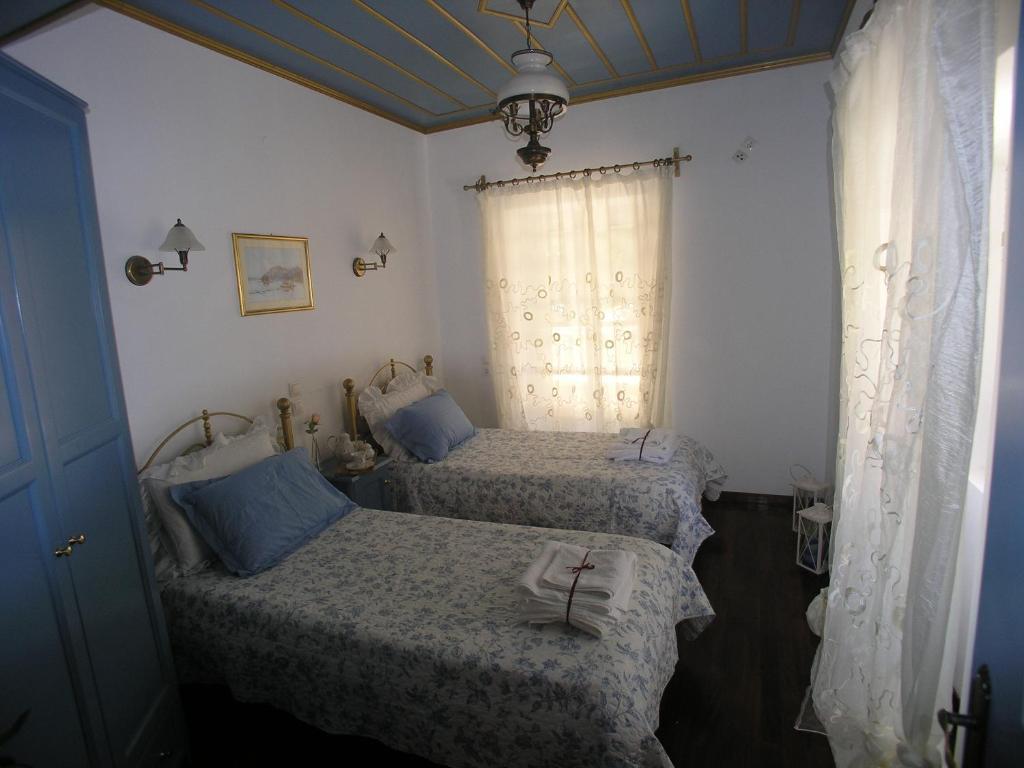 A bed or beds in a room at Traditional Stone Villa Olympia