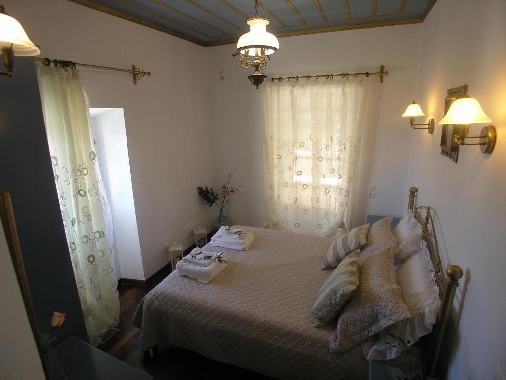 A bed or beds in a room at Traditional Stone Villa Olympia