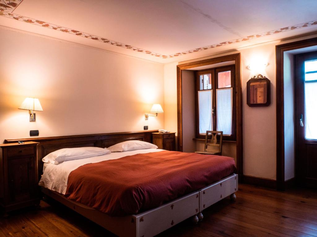 Postel nebo postele na pokoji v ubytování Albergo Montagna Di Luce