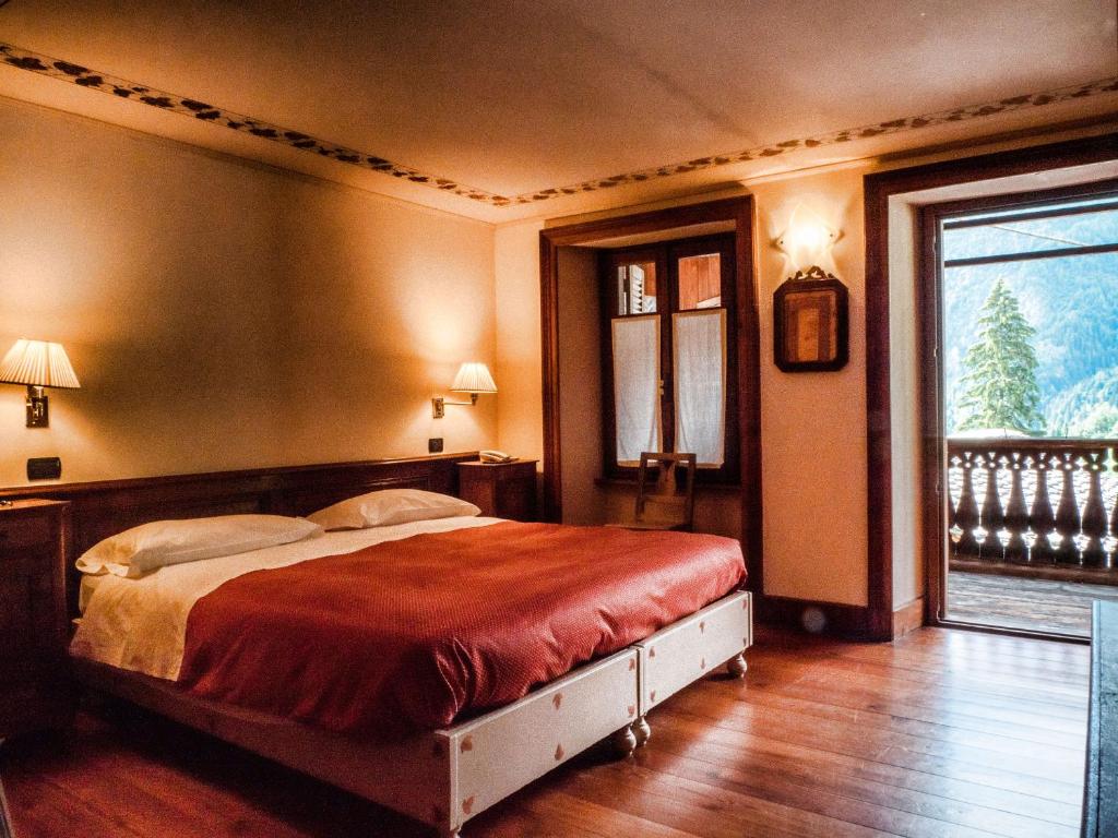 Postel nebo postele na pokoji v ubytování Albergo Montagna Di Luce